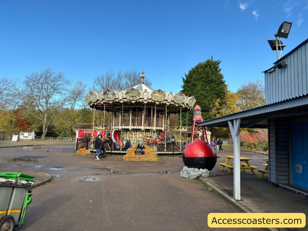 Wide view of the Carousel ride at Pleasurewood Hills from a distance, showing the entire attraction