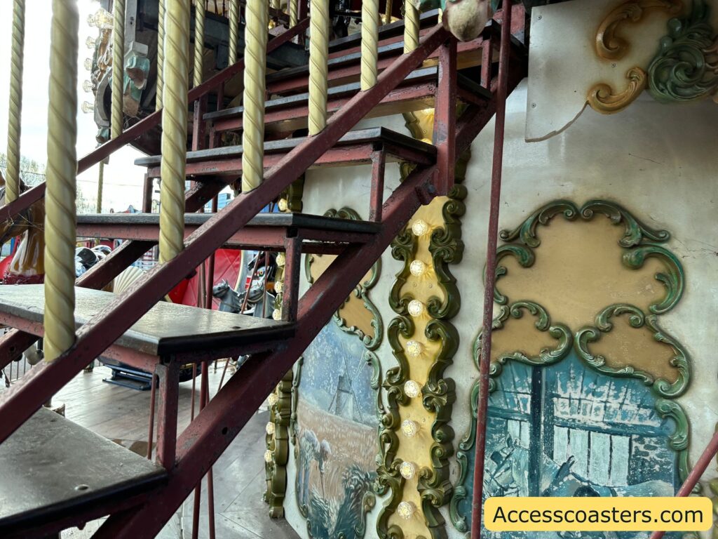 Metal staircase with handrails leading to the upstairs section of the Carousel at Pleasurewood Hills.