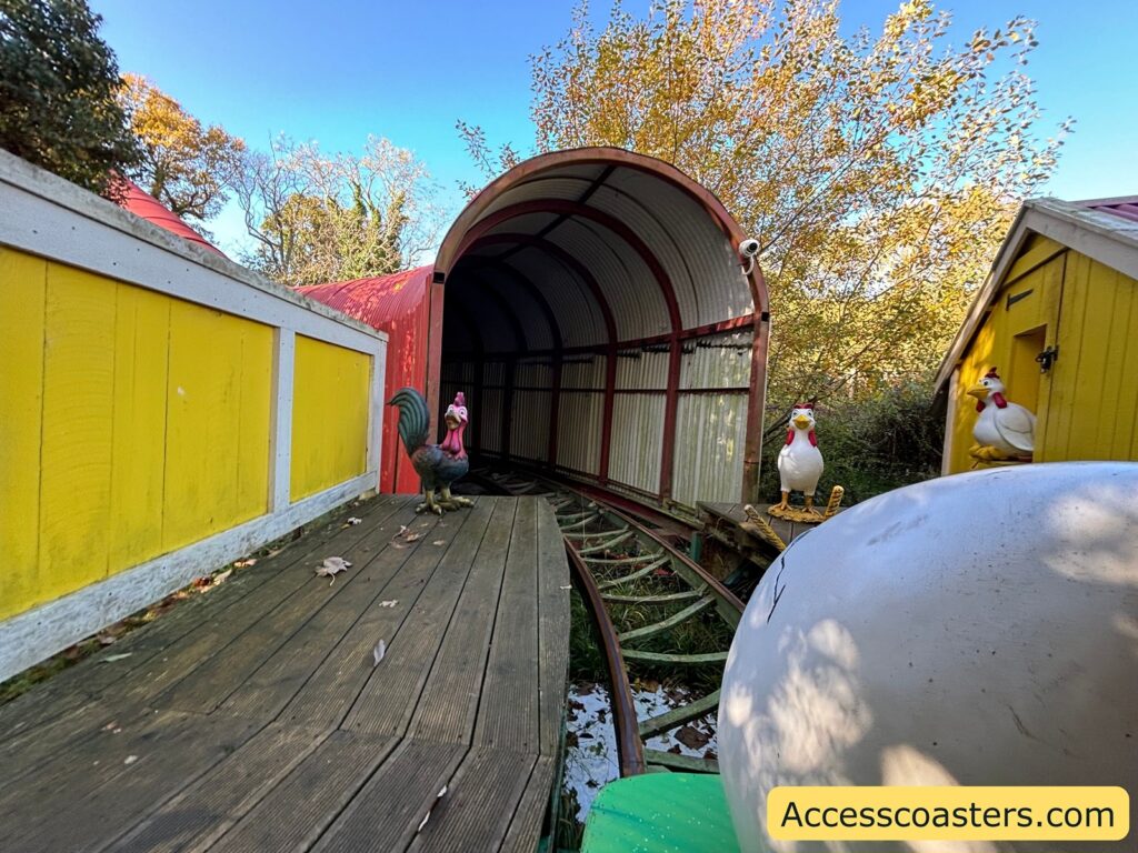 Wooden tunnel section of the Egg Spress track surrounded by trees.