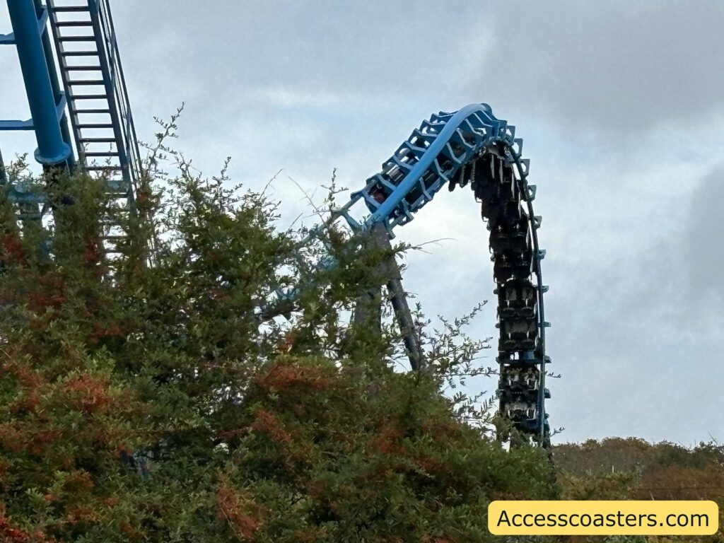 The Wipeout roller coaster track curving sharply upwards in a vertical loop, 