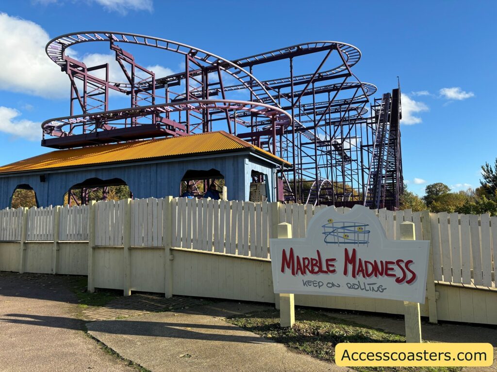  Marble Madness roller coaster structure with white fencing.