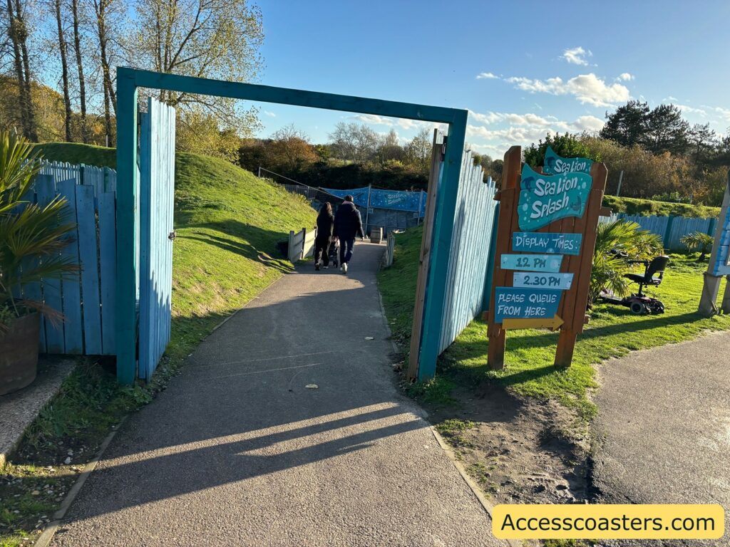 Pathway with a large sign leading into the Sealion Show area 