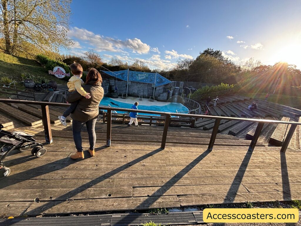 Viewing platform at the Sealion Show with a railing and a person looking towards the arena