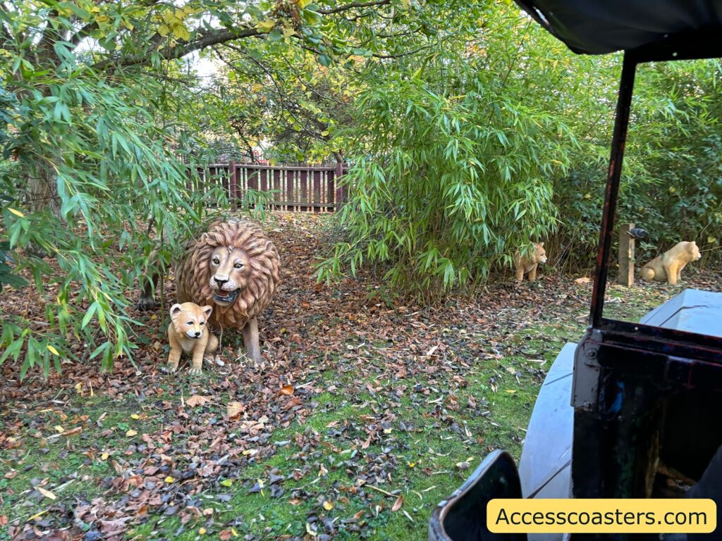  Safari animal models, such as lions, beside the ride track 