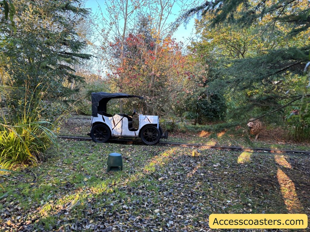 A safari jeep car from the ride is seen on the track