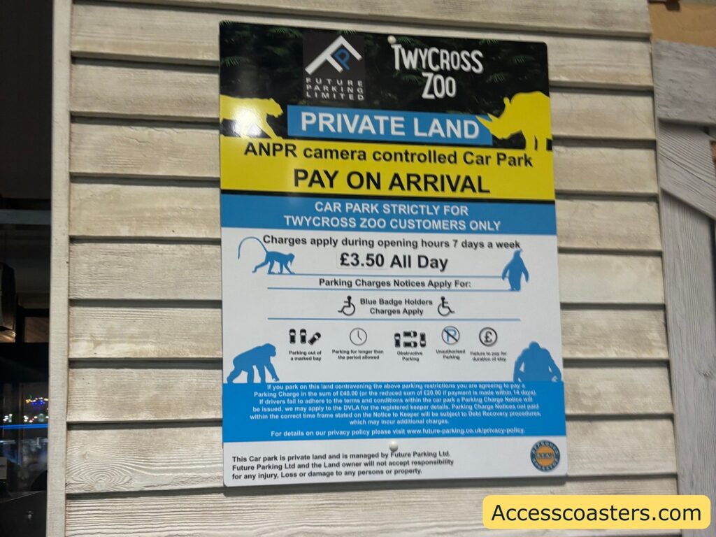Photo of a Twycross Zoo parking sign showing car park rules and “Pay on arrival” information.
