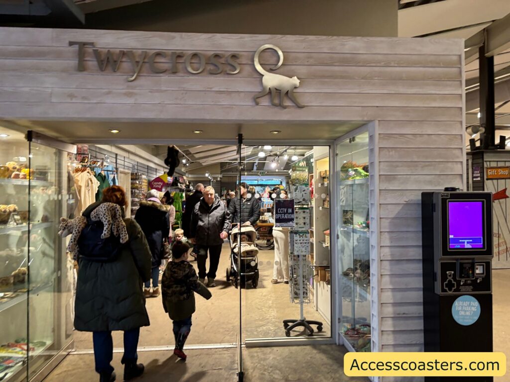 Twycross Zoo gift shop entrance with people browsing inside.
