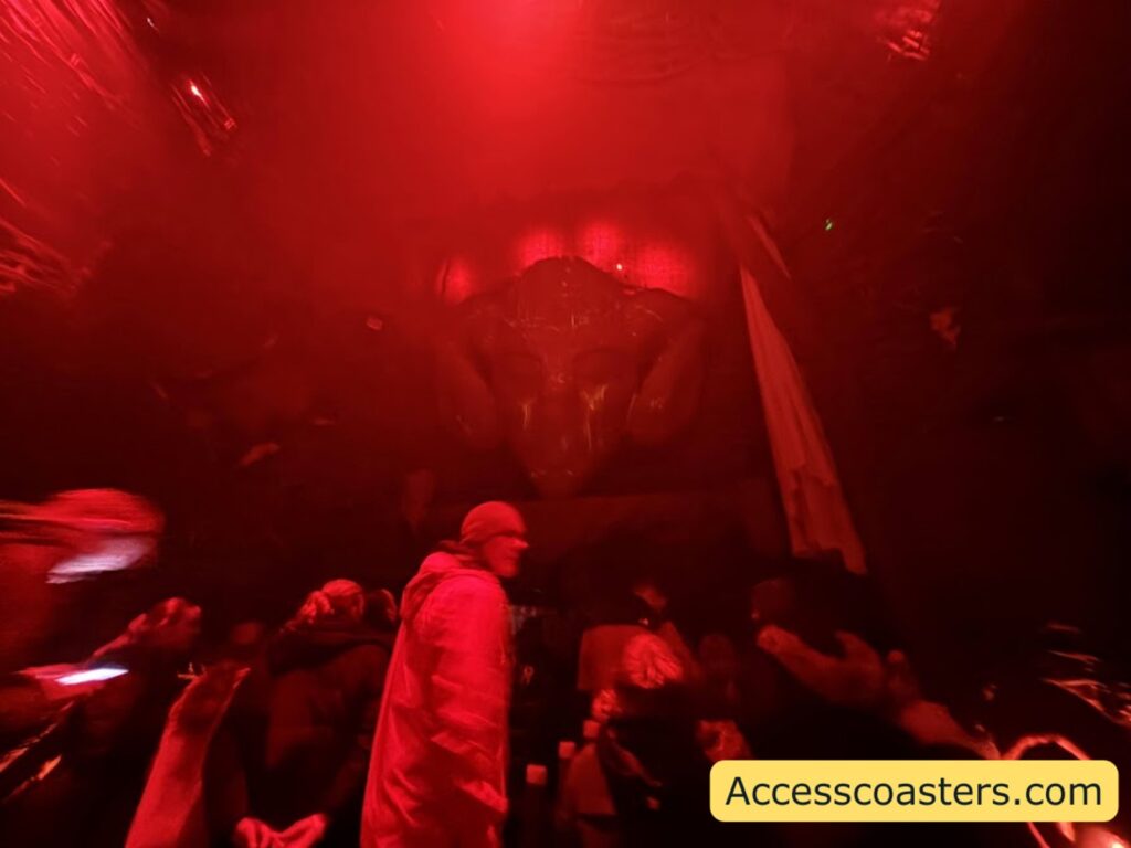 Red-lit room with Wicker Man-themed decorations.