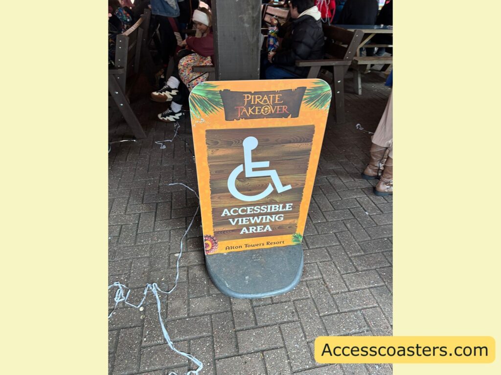sign post with wheelchair symbol that reads accessable viewing arrea