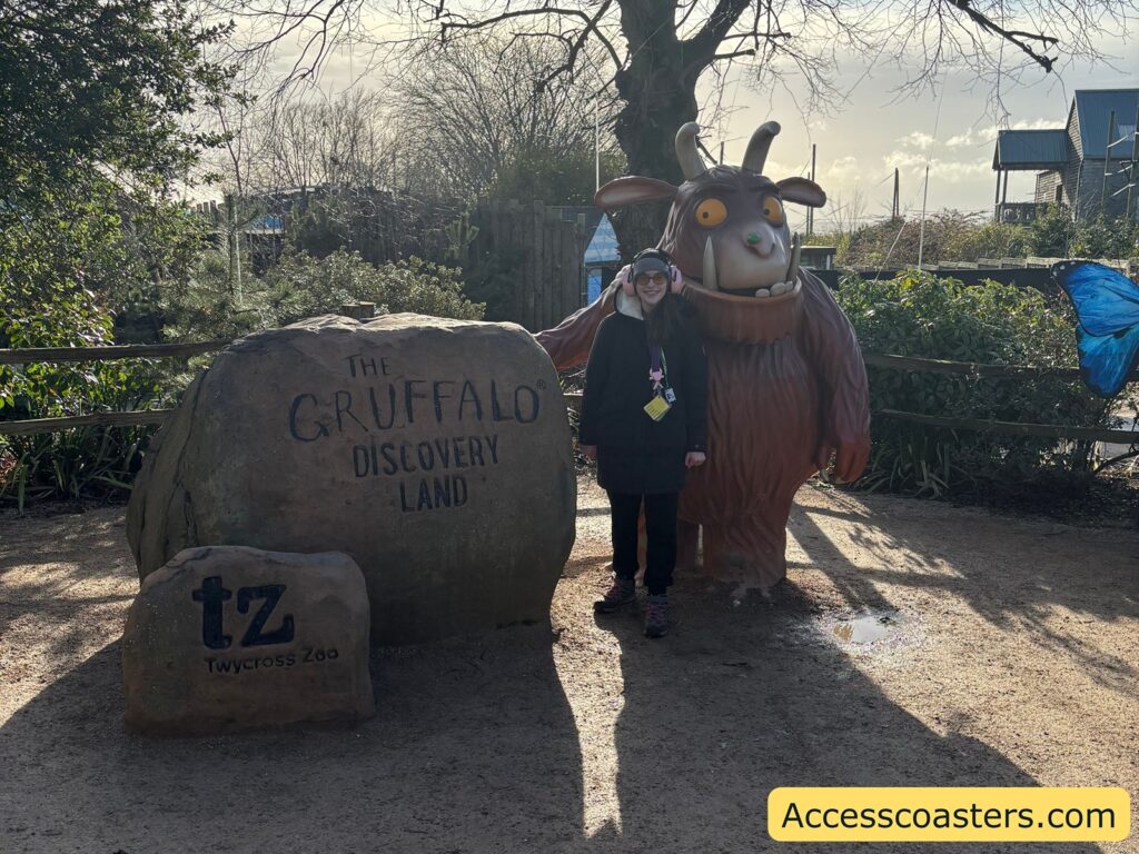 The Gruffalo character statue beside a large stone