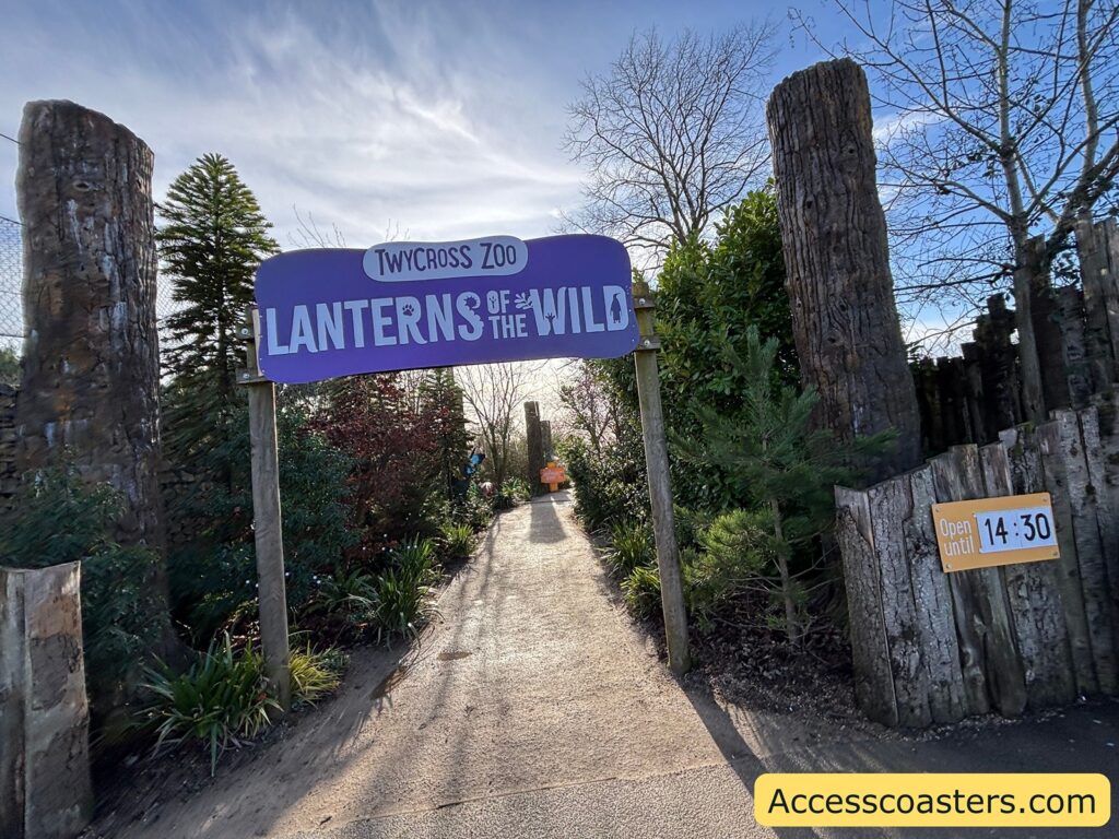 Entrance path with a large purple sign reading “LANTERNS OF THE WILD.”
