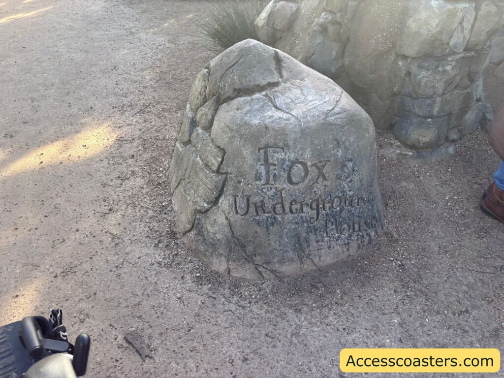 Large artificial boulder with carved sign text including “Fox,” marking the Fox section of the Gruffalo trail 