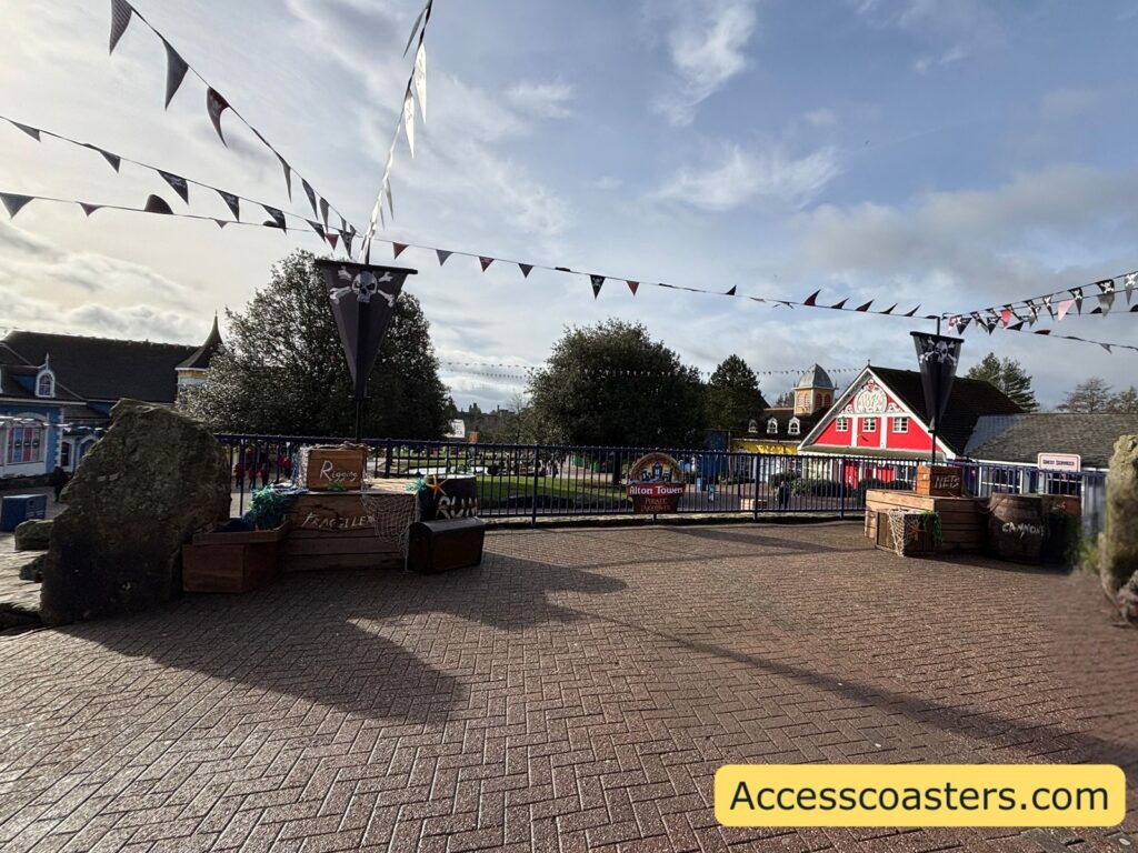 image of top of tower street with pirate theming you can see down towers street with lots of colourful buildings and pirate theming in the middle.