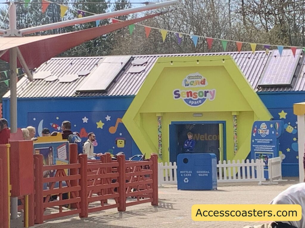 image of outside of sensory room. with a wide doorway and staff member stood outside.