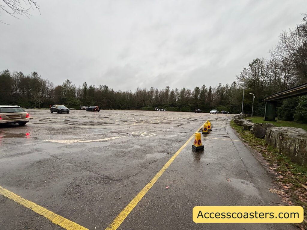 overvview of pretty empty blue badge car park with lots of yellow marked parking spaces