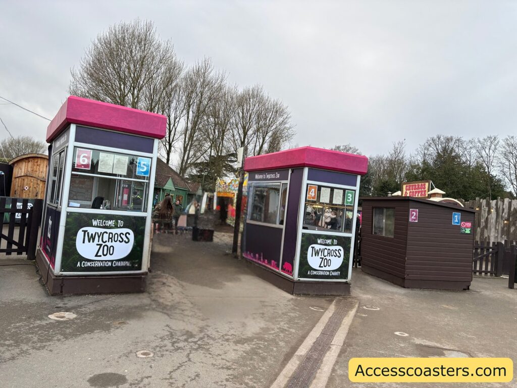 Entry booths with pink roof trim near the entrance area.
