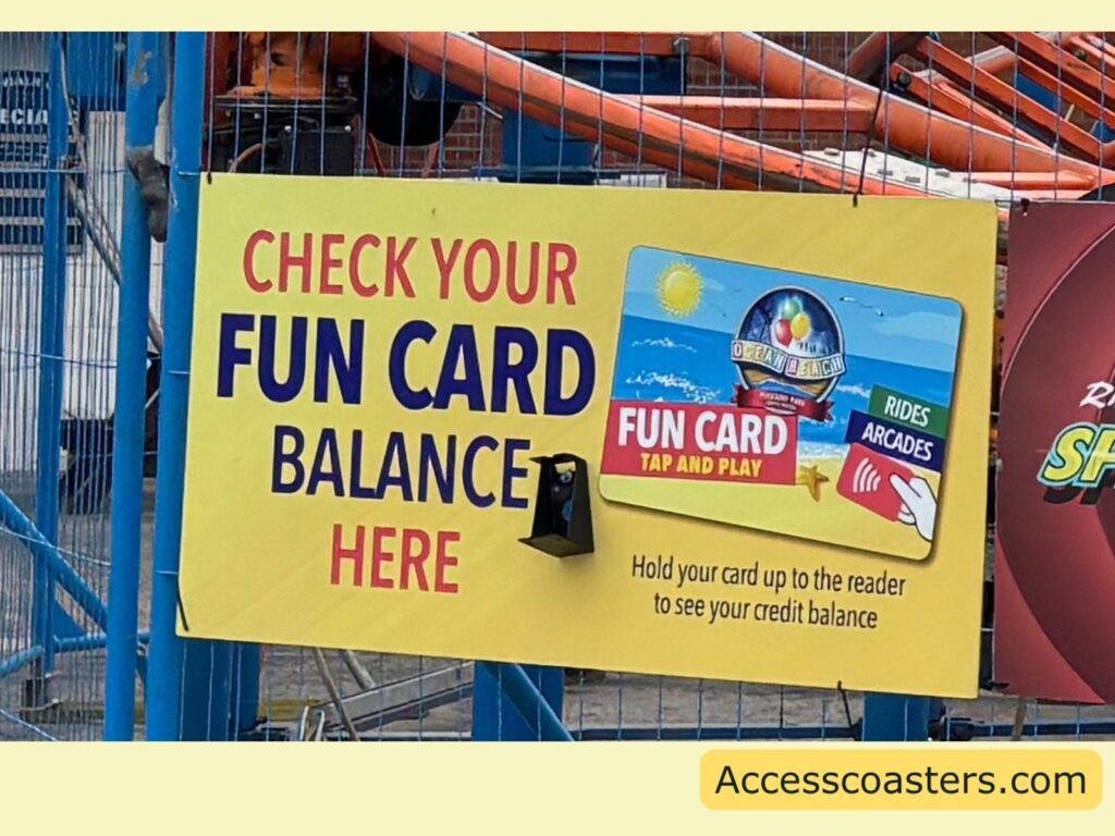 image of card scanner with digital screen attached to a sign that reads check your fun card balance here 