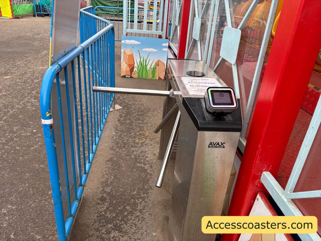 image of turnstile with a digital box to tap your fun card on. 