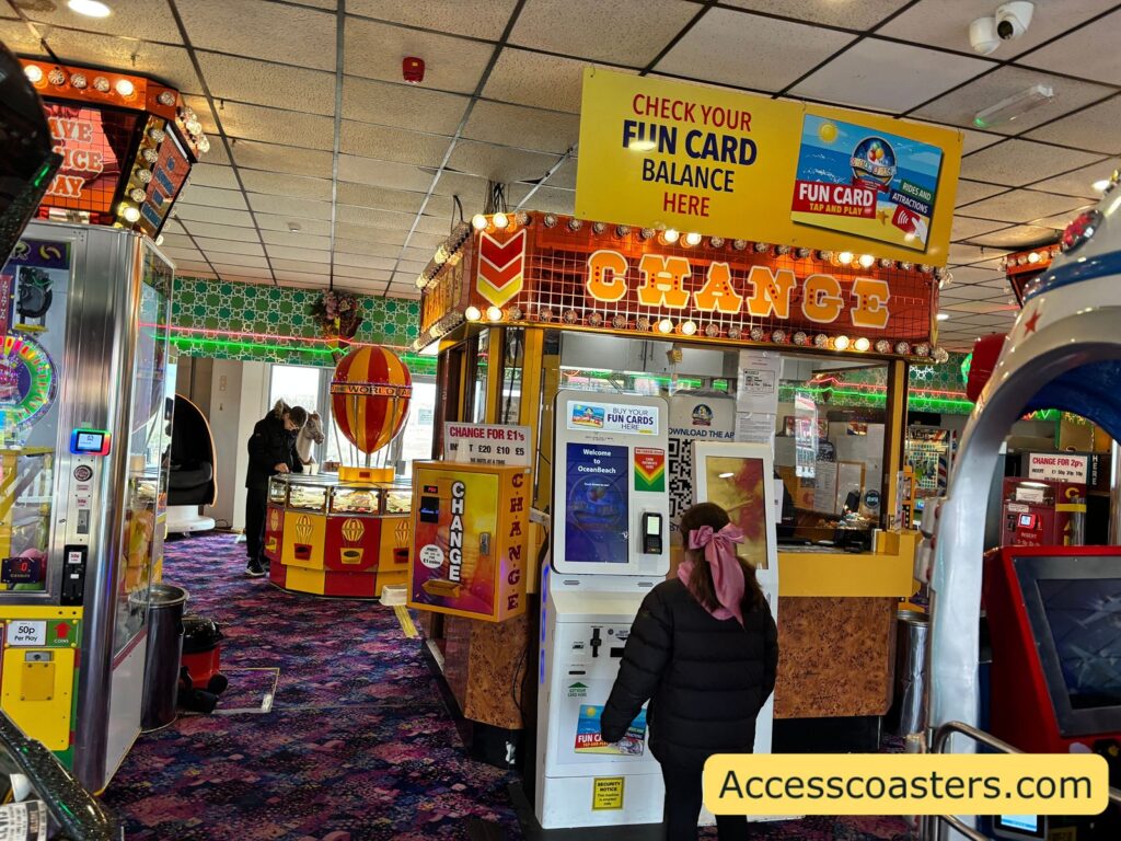 image of  the change counter in an arcade with a member of staff behind and a big change sign. 