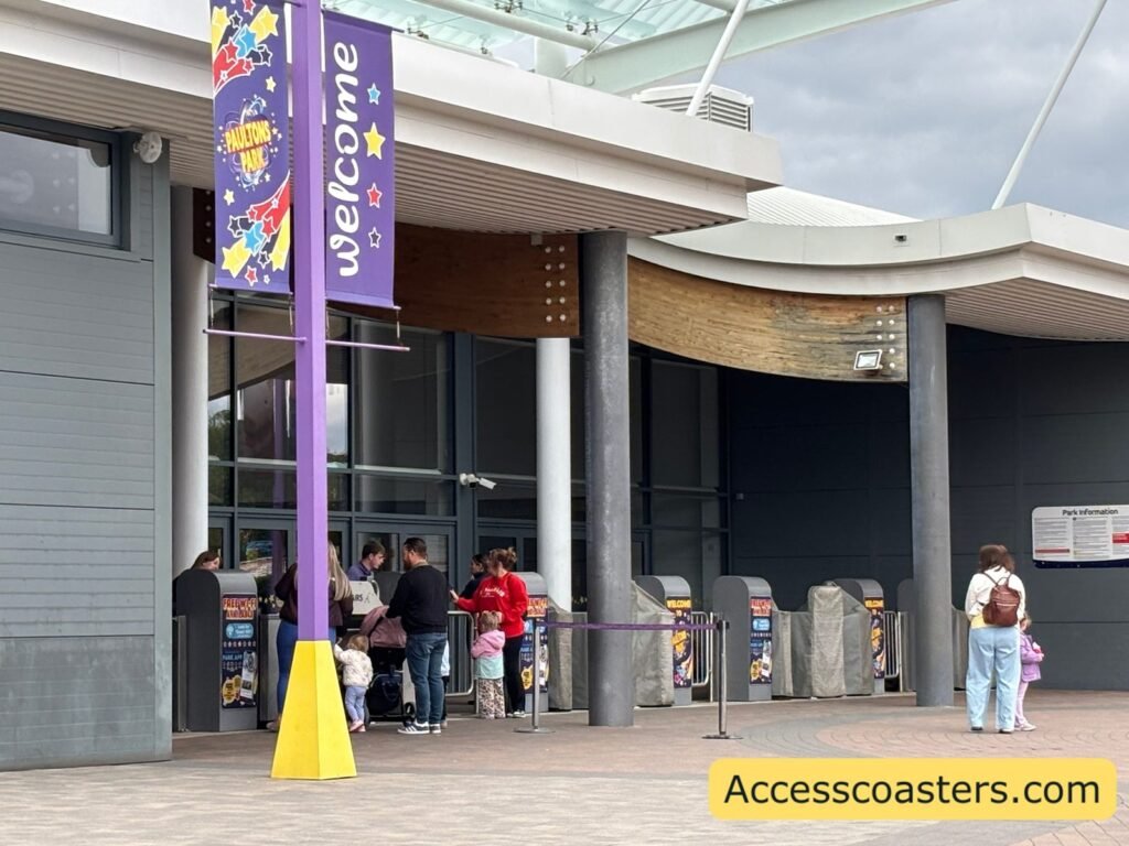 image of turnstiles at paultons park you can see some gates and turnstiles with measuring sticks. 