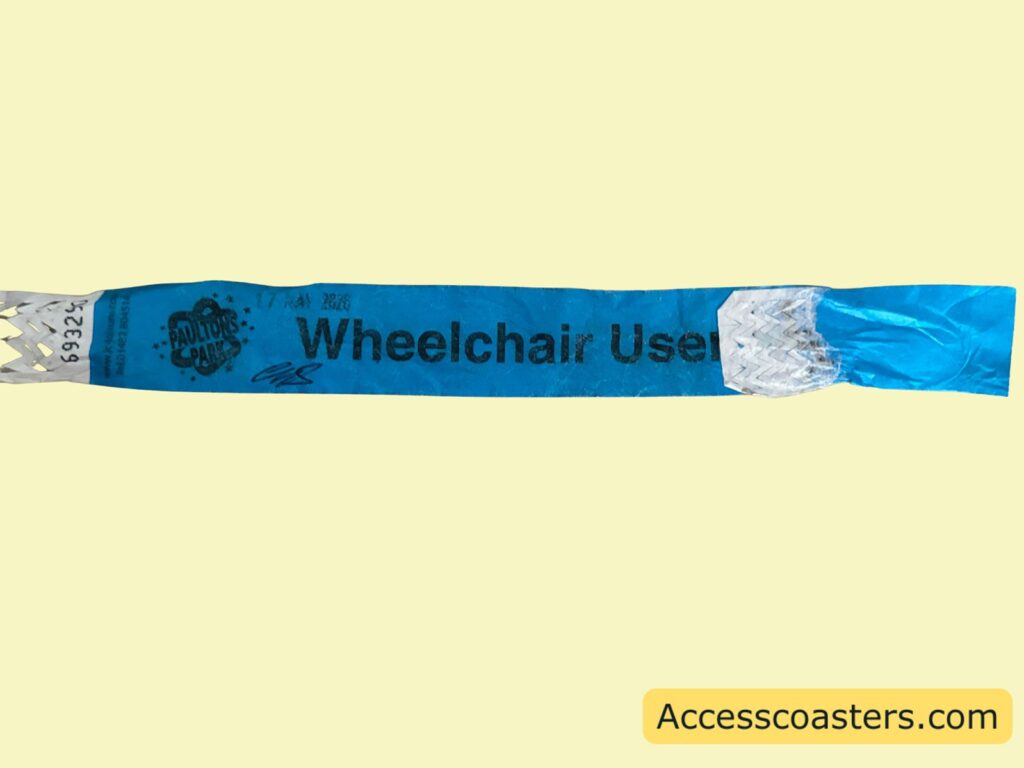 image of blue wristband that says wheelchair uder with the paultons park logo on. 