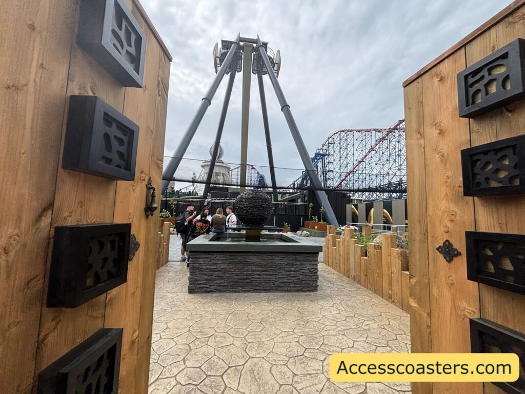 image of the Aviktas entrance plaza through the doors there is a water fountain and Aviktas arm behind