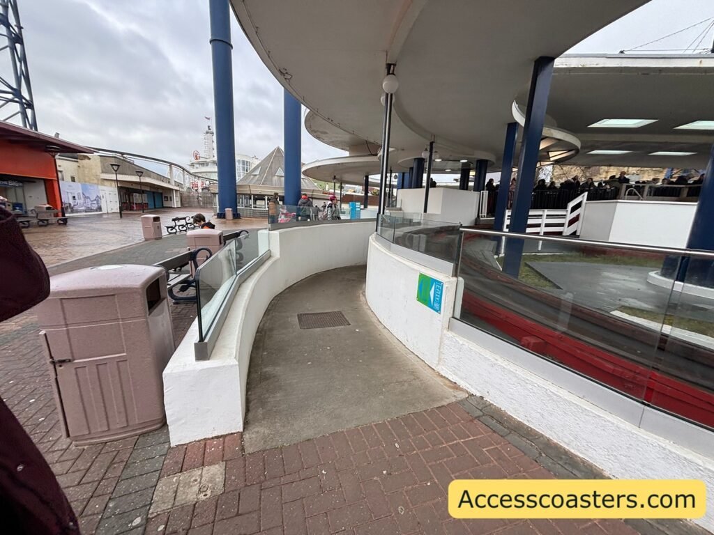 image of easy access pass queue line entrance with entrance sign and path leading into the station