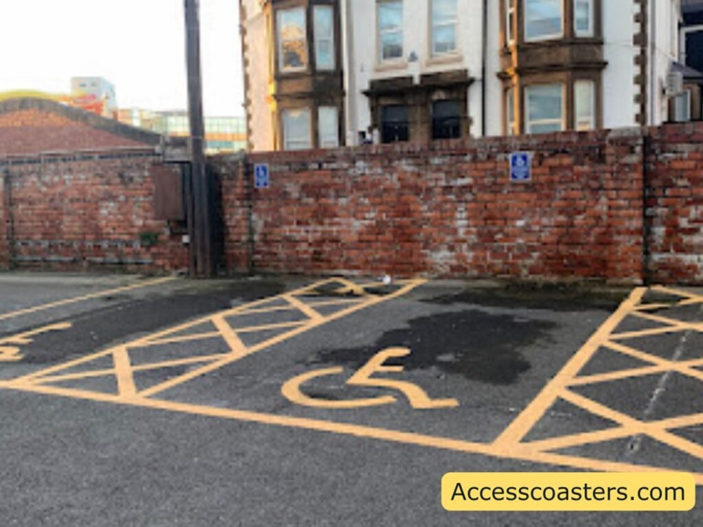 image of blue badge parking space with yellow hatchings on each side and the wheelchair symbol in the middle.