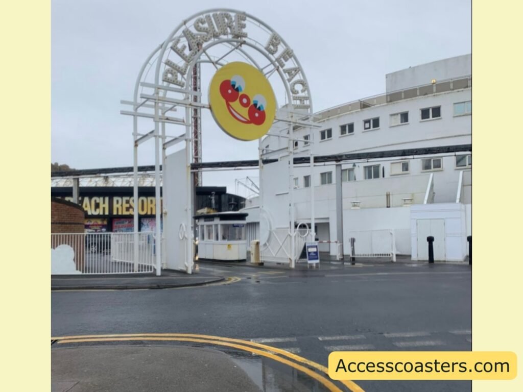 white entrance arch to car park with sign that reads plesure beach a big image of fun shine