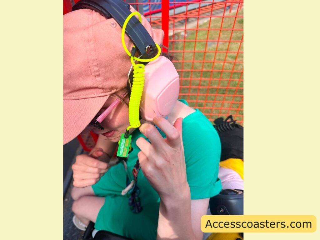 image of Iona with the ear defender tether on you can see it looped around the headband of Iona ear defenders and the clip attached to Iona tio