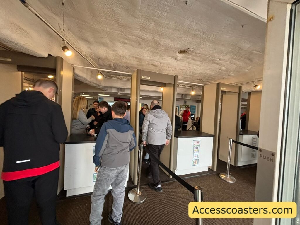 plesure beach security can see 3 security booths for checking bags and scanners to walk through. 