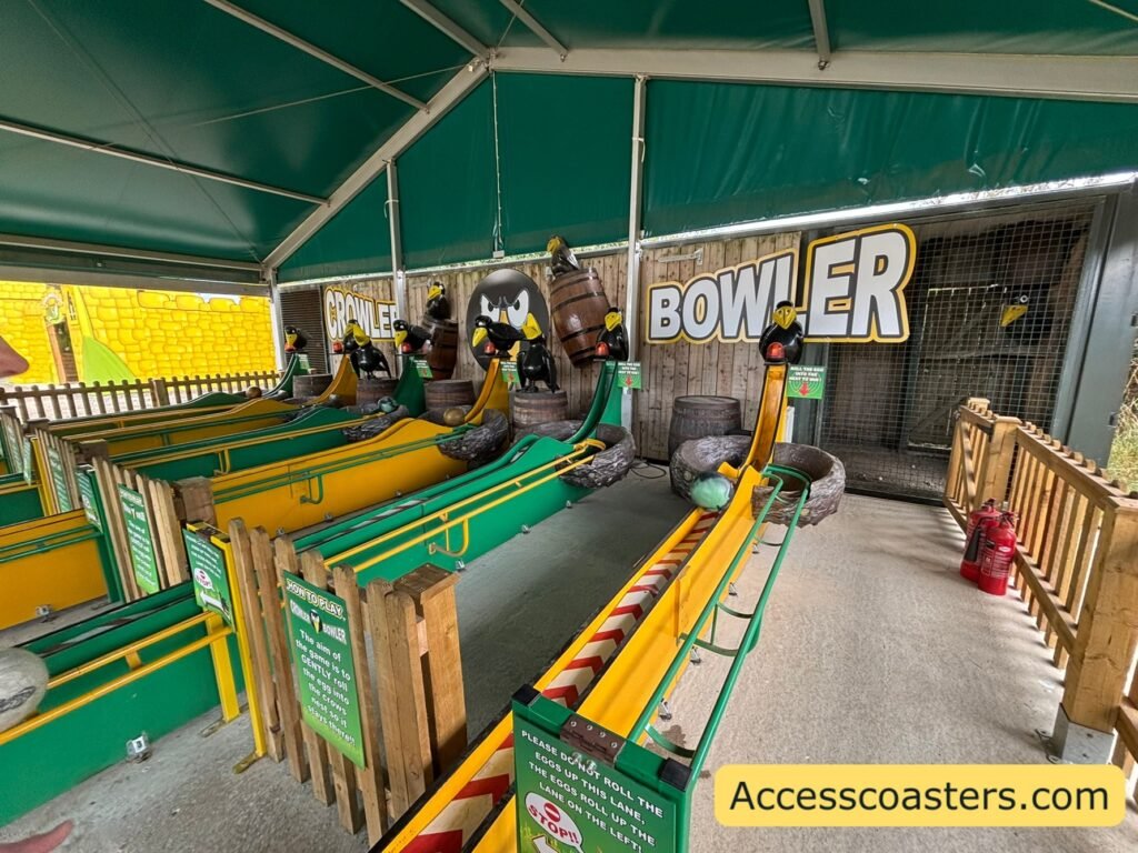image of outdoor bowling style game with 6 stations where you can roll the ball and try get it to stay in the Crows nest. 