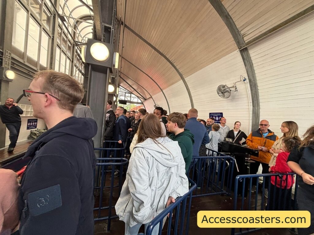queue line in ride station of cattel pen queue with peoeple queueing to get to the air gates and merge point for easy access 
