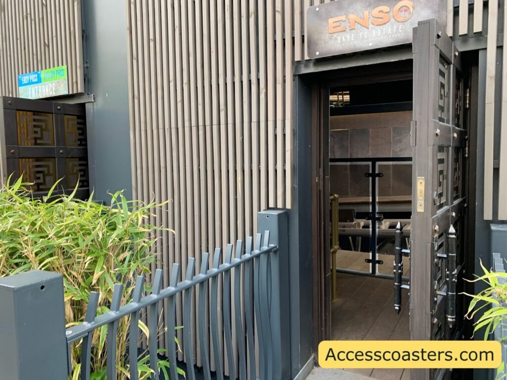 to entrance door ways leading into station building one door labled enzo the other labled speedy pass an easy pass 