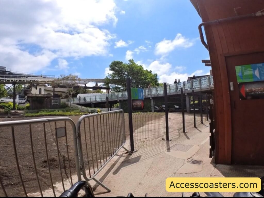 sppedy pass an easy access pass entrance to Icon with arrowed signage and heigh fences forming queue line path 
