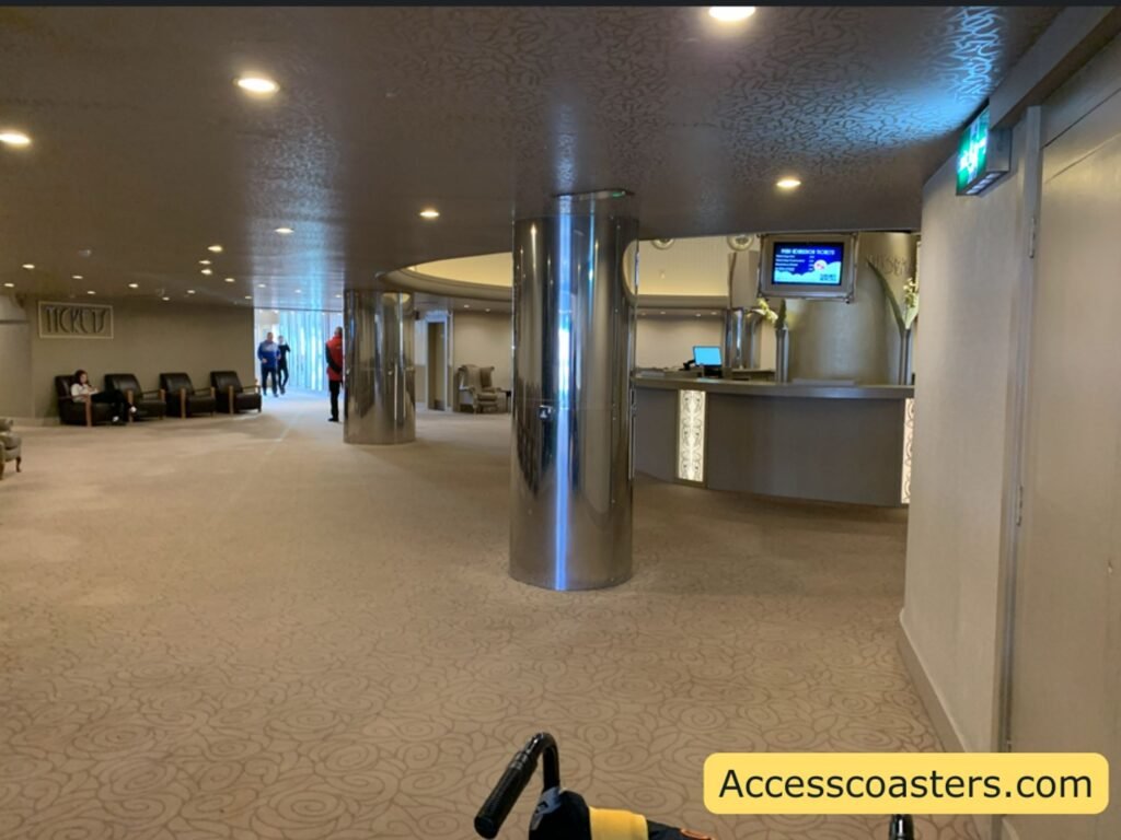 inside plesure beaches ticket office with chairs around the edge of the room and counter for ticket office