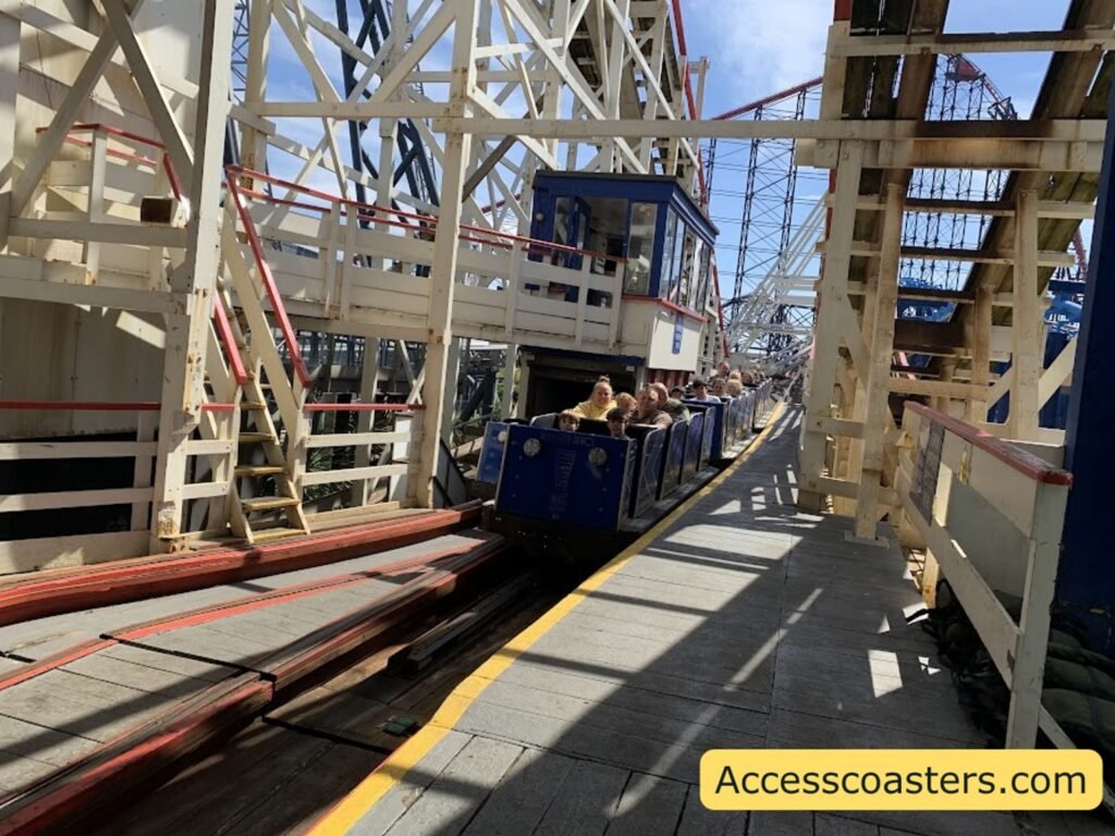image if big dipper break run you can see the train with guests riding on the break rub with the big dipper's wooden  track supports in the background.  