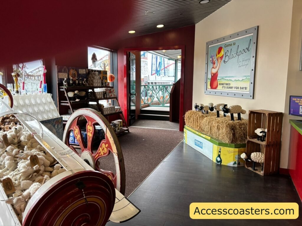image shows 2 steps down for the ride exit into the gift shop. you can see lots of themed merchandise in the image like a display rocket filled with soft toys. 