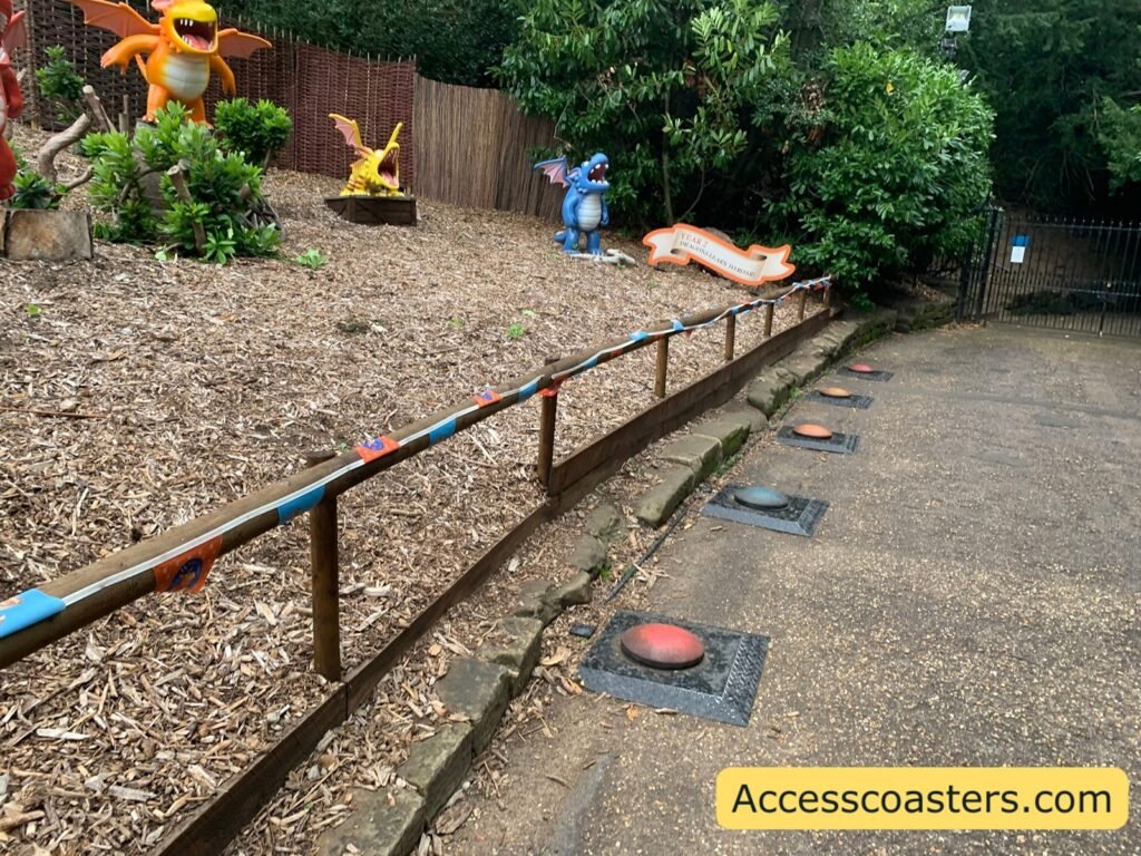 image of fenced of display with lots of dragon from the Zog book and Infront big button on the floor to jump in and make them roar. 