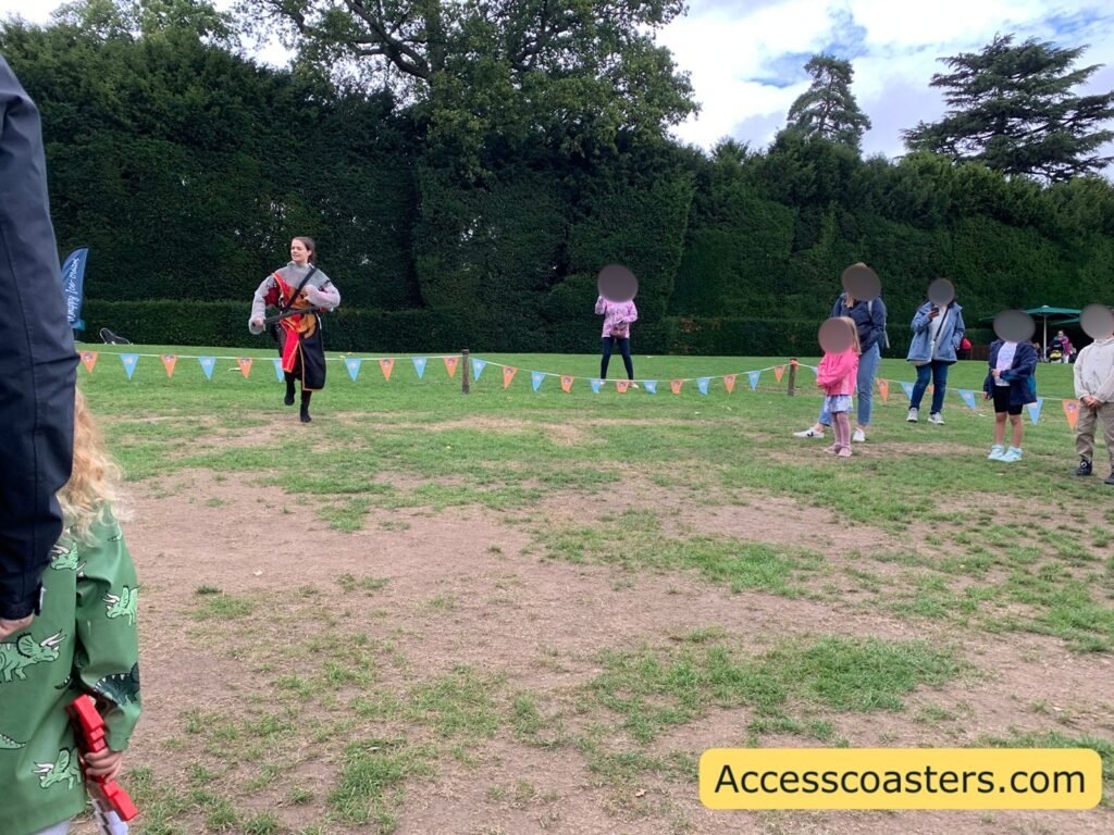 image of Zog's knight school in action with a lady dressed as a knight leading the moves and lots of children joining in. 