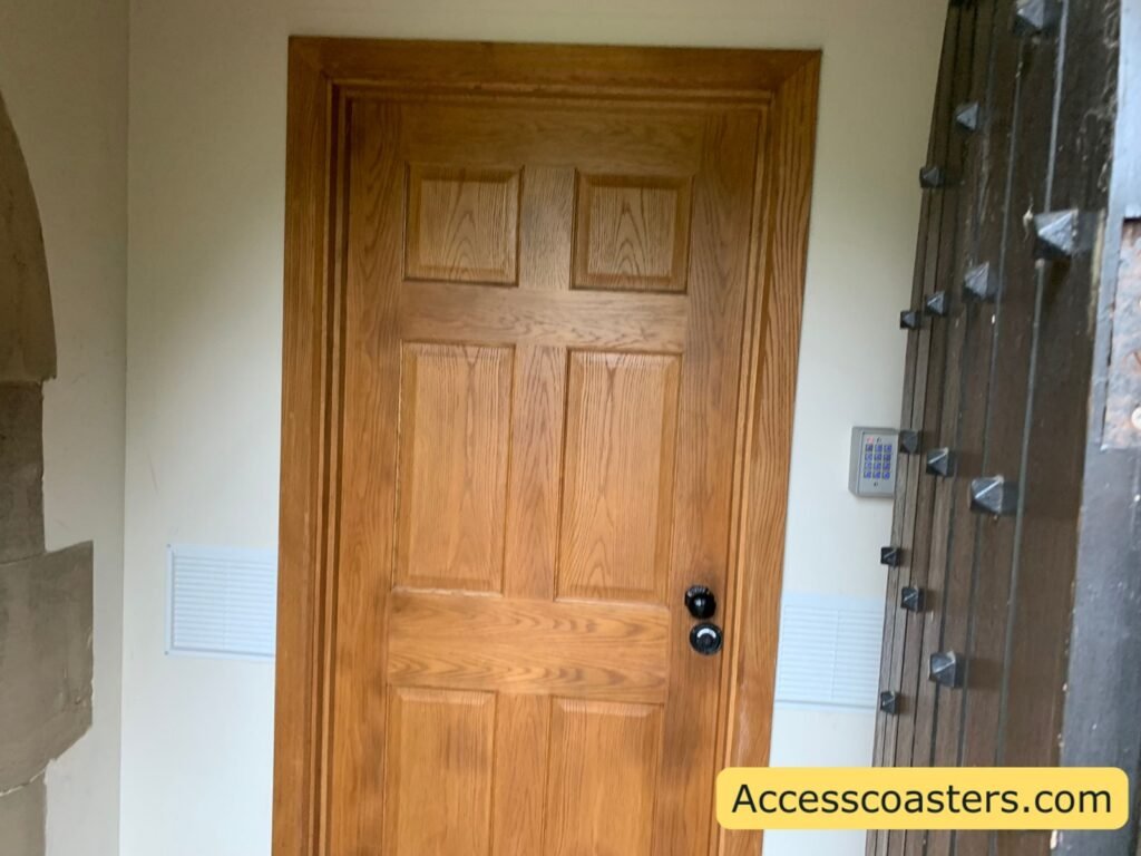 Close up of the internal wooden door to the Welfare and Sensory Room, with a keypad-style control panel on the wall