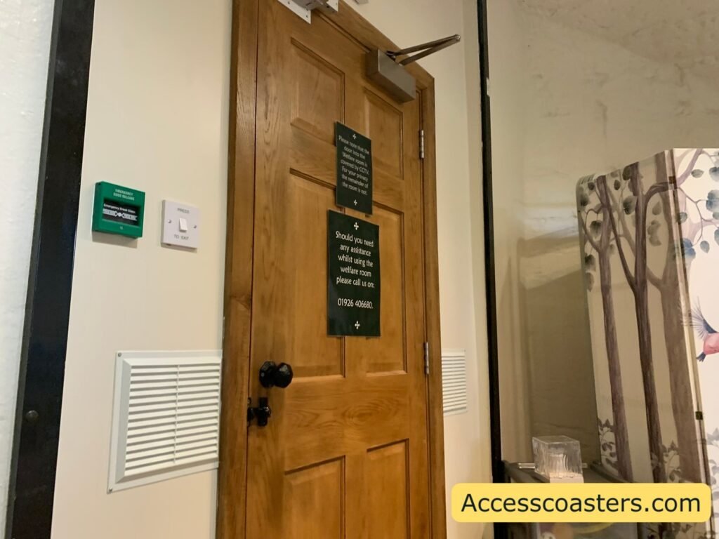 Interior wooden door of the Welfare and Sensory Room with green exit swich on the wall