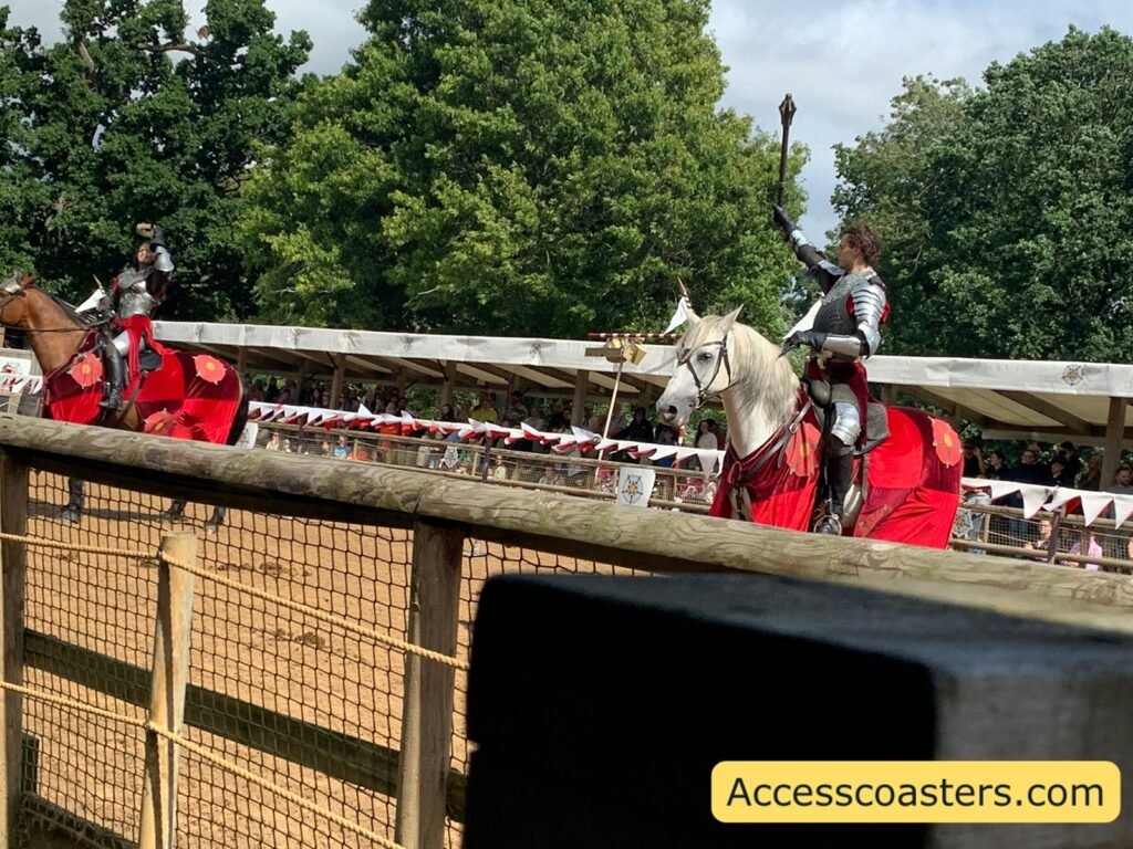 Two armoured riders on caparisoned horses waiting in the Wars of the Roses Live arena